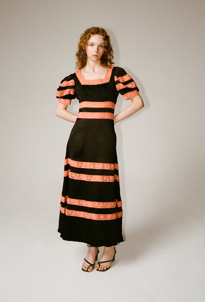 black and orange midi dress