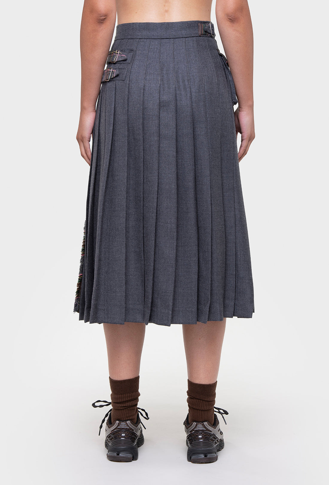 Shrimps Anya wool Kilt. Grey Stewart tartan kilt with contrasting plain grey on the back. Buckle fastenings with side pocket. Woven and made in Scotland. AW26