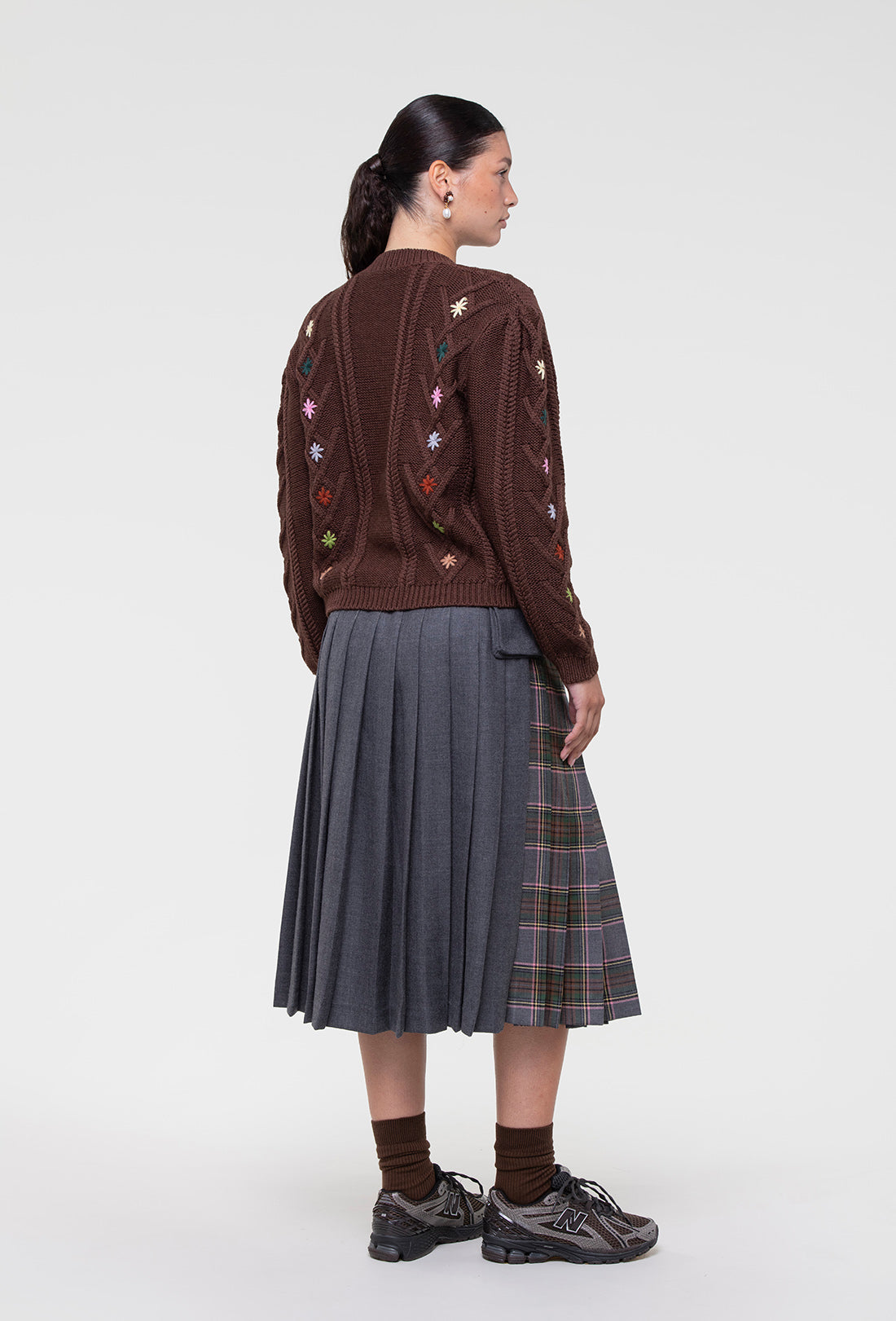 Shrimps Anya wool Kilt. Grey Stewart tartan kilt with contrasting plain grey on the back. Buckle fastenings with side pocket. Woven and made in Scotland. AW26