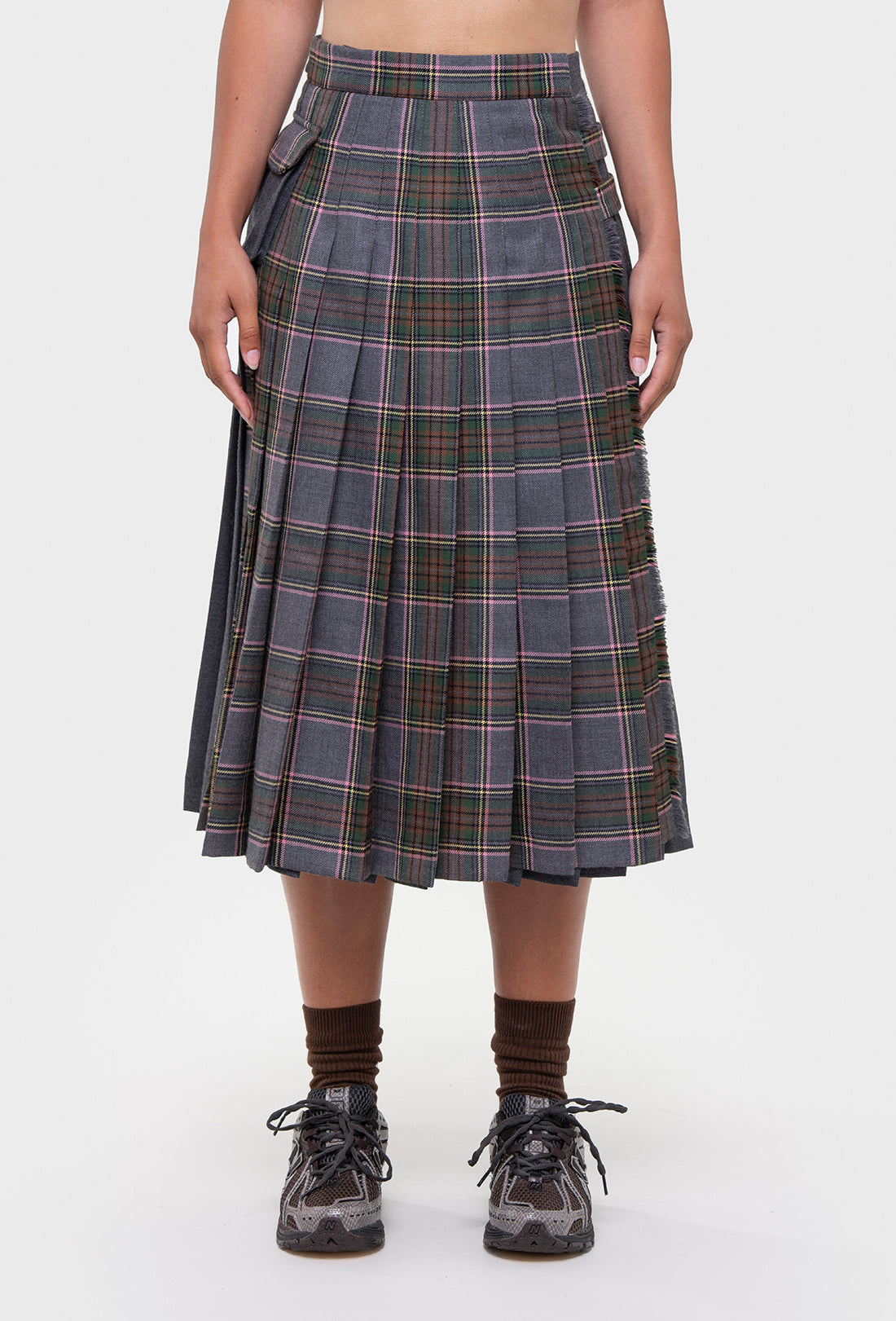 Shrimps Anya wool Kilt. Grey Stewart tartan kilt with contrasting plain grey on the back. Buckle fastenings with side pocket. Woven and made in Scotland. AW26