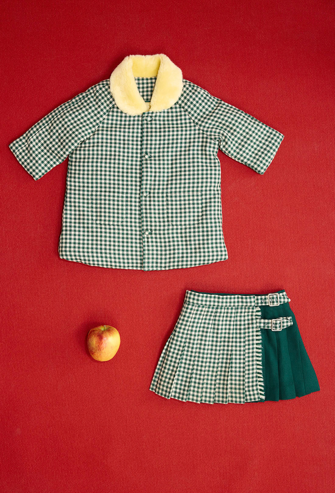 Shrimps baby &amp; kids Darcy kilt. Green Gingham wool, wrap-around skirt with buckle fastenings. Calville bay &amp; kids wool gingham coat. AW26.