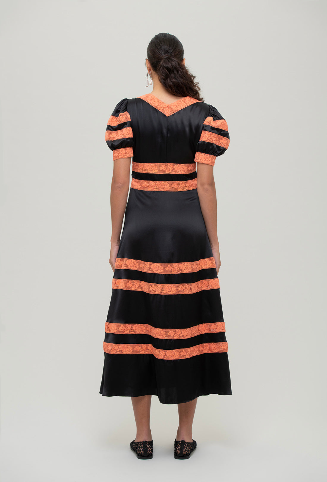 black and orange midi dress