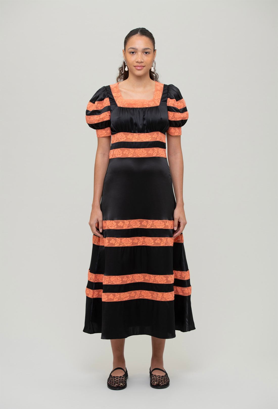 black and orange midi dress