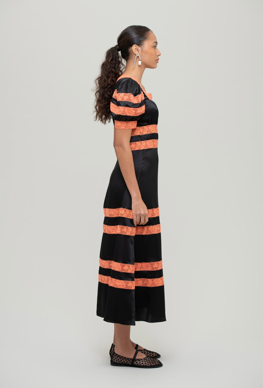 black and orange midi dress